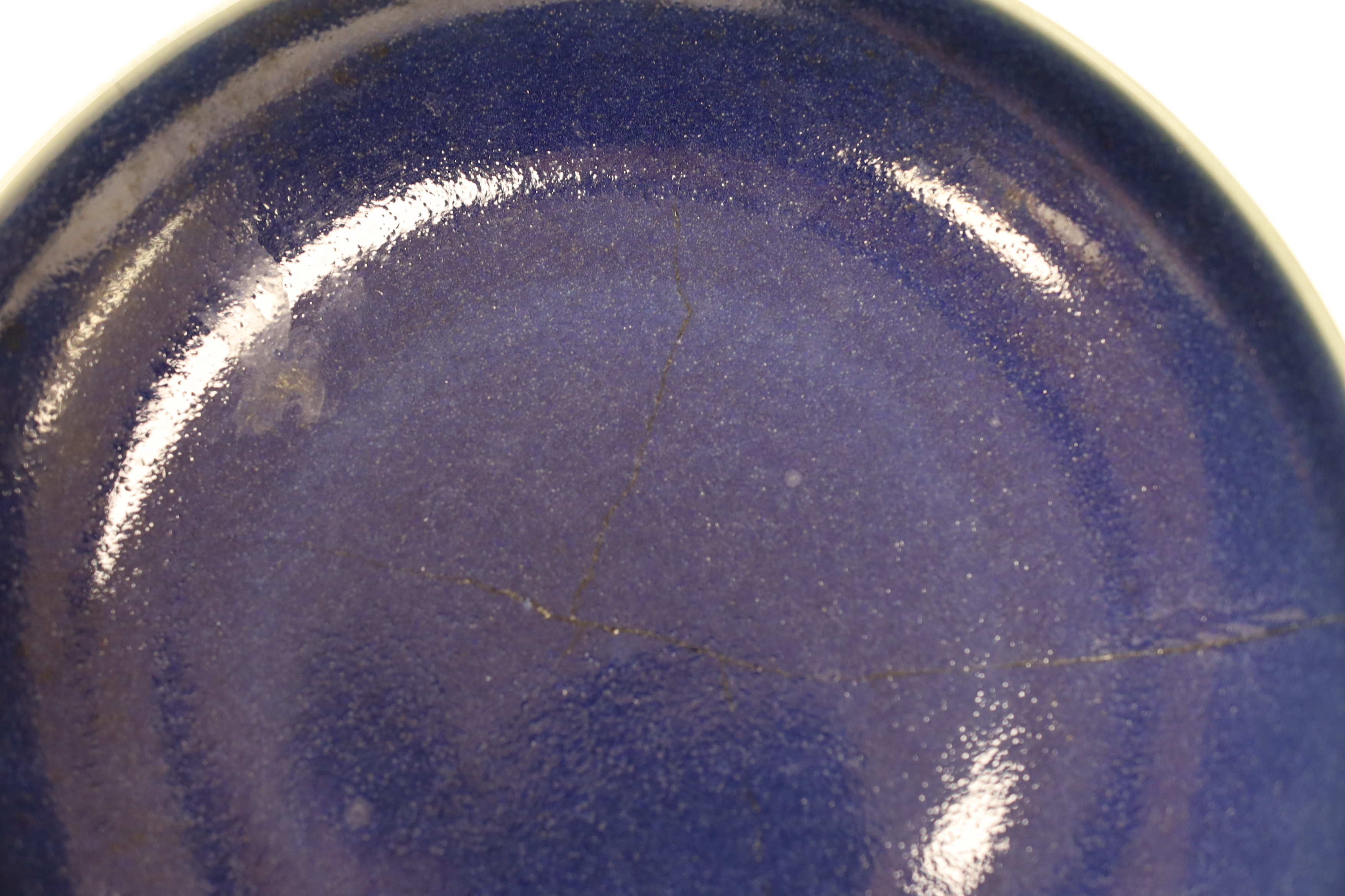 A Chinese blue glazed dish, Yongzheng mark but later, 22.5cm diameter